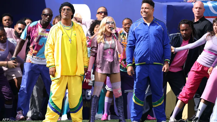 the global pop legend Madonna with a performance of her famous song Music as she made a remarkable entrance onto the field accompanied by the famous Brazilian football duo Ronaldo and Ronaldinho